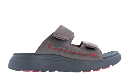 A brown sandal with red trim. Description generated by AI